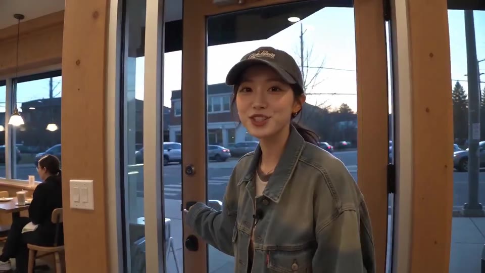 Adult creator visiting an original unbranded café with a compact camcorder