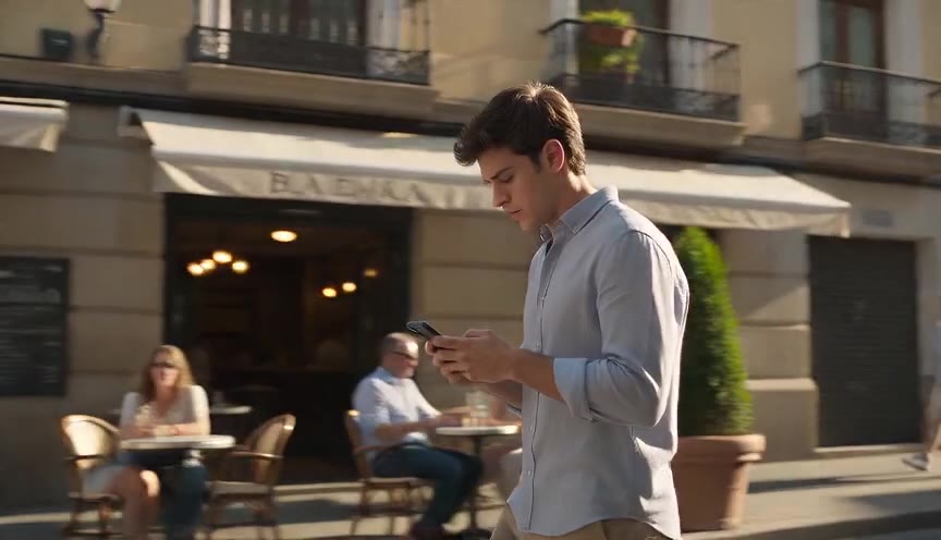 Two adults meeting safely over a blue scarf on a pedestrian lane
